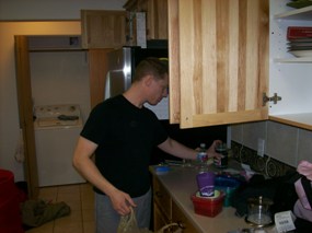 Jeremy unpacking the kitchen